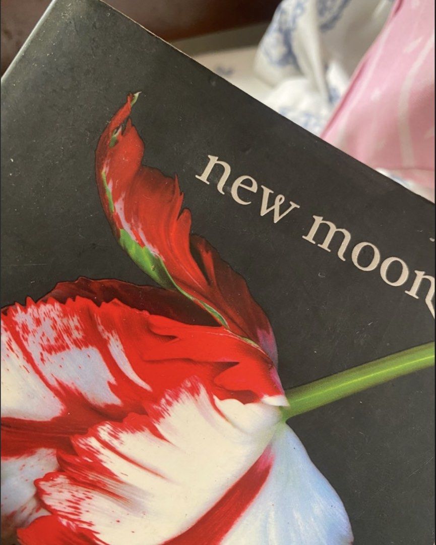 New Moon by Stephenie Meyer - Twilight Saga Book 2 (Category: Storybooks) located in Imus. Submitted by yangpreloved (Listing ID 1454609517, Image 3). Description: - New Moon: The Twilight Saga, Book 2 by Stephenie Meyer - Red and white tulip cover - Yellowing pages - Minor wear on the cover edges.