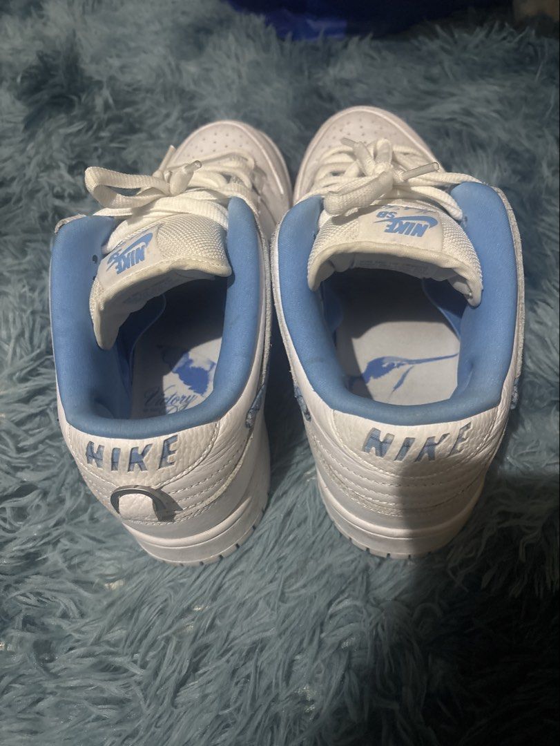 Nike SB Dunk Low "University Blue" White Light Blue (Category: Sneakers) located in Manila. Submitted by newshark_b237f7 (Listing ID 1454740370, Image 3). Description: - Nike SB Dunk Low in White and Light Blue - Classic silhouette, ideal for everyday wear and skating - Perforated toe box for breathability - "NIKE" branding prominently displayed on the heel complete box and extra laces - Crisp white laces - Unique graphic print on the inner sole.