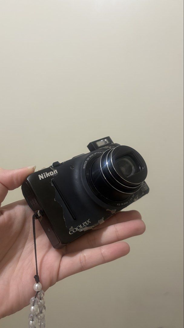 Nikon Coolpix S9300 18x Optical Zoom Digital Camera (Category: Cameras) located in Pasig City. Submitted by sheenuh (Listing ID 1454657583, Image 2). Description: DM for sample shots! - Nikon Coolpix S9300 digital camera - 18x optical zoom for versatile shooting - Full HD 1080p video recording - Minor cosmetic wear on body (please check photos) - Comes with a stylish beaded wrist strap - Ideal for everyday photography and travel adventures.