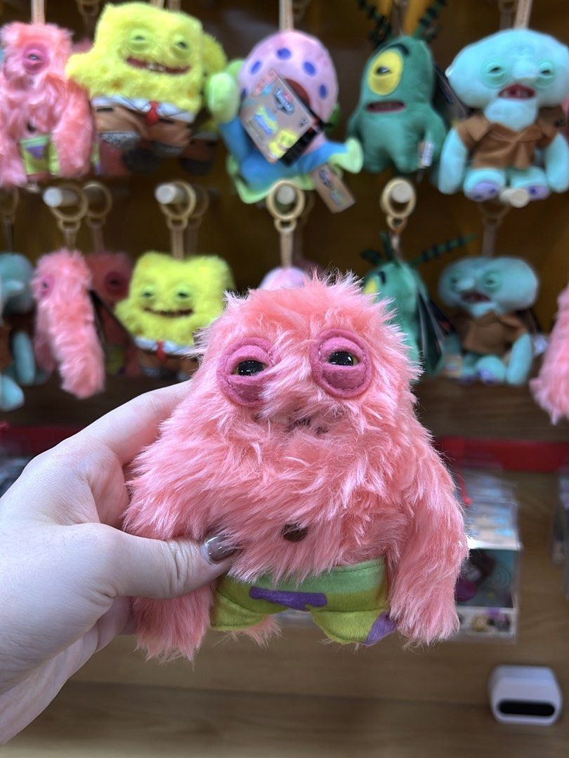 [ON HAND] Fuggler Spongebob Patrick Star Plush Keychain (Category: Plushies & Soft Toys) located in Manila. Submitted by applepieph (Listing ID 1454578081, Image 2). Description: - Authentic bought from China Official Fuggler Store - Super cute Fuggler keychain featuring Patrick Star from Spongebob. - Signature Fuggler "quirky" look. - Perfect accessory for your bag or keys. - Highly collectible item. - Brand new with tag still attached..