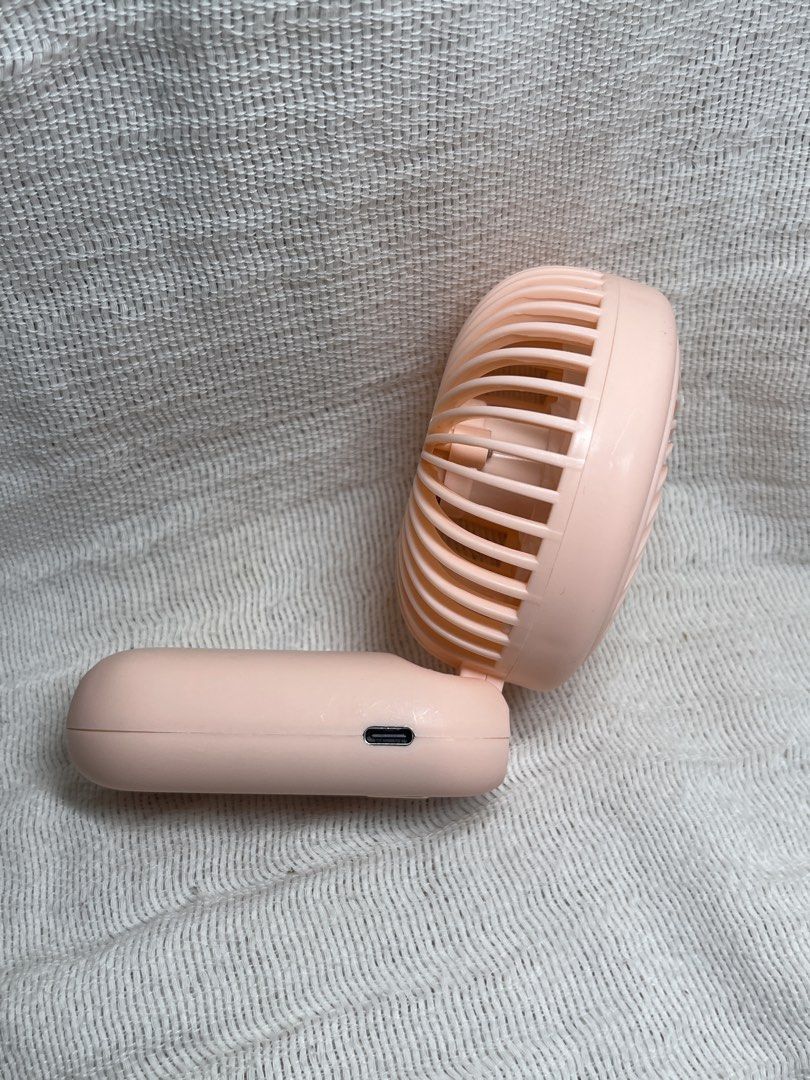 ONESTAR Mini Folding Fan ST-F088 (Category: Fans) located in Manila. Submitted by prima_onda (Listing ID 1454643760, Image 3). Description: - Portable mini fan in pink - Folds compactly for easy storage - Comes with USB charging cable - Includes a convenient wrist strap - Perfect for staying cool on the go.