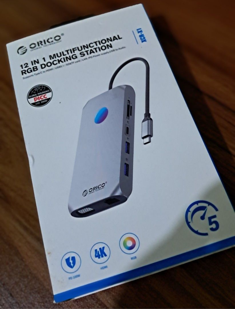 ORICO 12 in 1 Multifunctional RGB Dock (Category: Laptops & Notebooks) located in Pasig City. Submitted by jd.carousel (Listing ID 1454693357, Image 3). Description: Comes with box and manual. Specs. HDMI 4K/60hz Rose Gold color Ports; 1 Type C PD 100W, 2 USB-A 3.1, 1 USB-A 2.0, 1 Type C 3.1, 2 HDMI 2.0, 1 VGA, 1 SD/TF 3.0, 1 LAN And 1 3.5mm aux. Pickup or delivery option. Delivery fee is shouldered by the buyer. Note: there's a rubber sticker fo