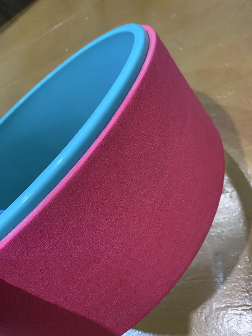 Pink and Teal Yoga Wheel for Stretching and Backbends (Category: Toning & Stretching Accessories) located in Manila. Submitted by gracefilledshop (Listing ID 1454632049, Image 3). Description: - Used ONCE - Enhance your yoga practice with this versatile wheel. - Perfect for improving flexibility and deepening stretches. - Sturdy construction with a reliable, non-slip grip. - Features a textured pink outer layer and a vibrant teal inner ring. - Id