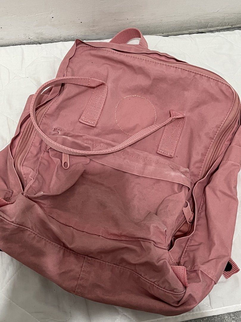 Pink Fjallraven Kanken Backpack (original) (Category: Backpacks) located in Manila. Submitted by lai.p (Listing ID 1454614356, Image 1). Description: - Classic pink Fjallraven Kanken backpack - Shows some signs of wear (front pocket, straps) - Plenty of life left, still very functional - Perfect for school or everyday use - Zippers are in good working condition - Features a roomy main compartment and a convenient front pocket.
