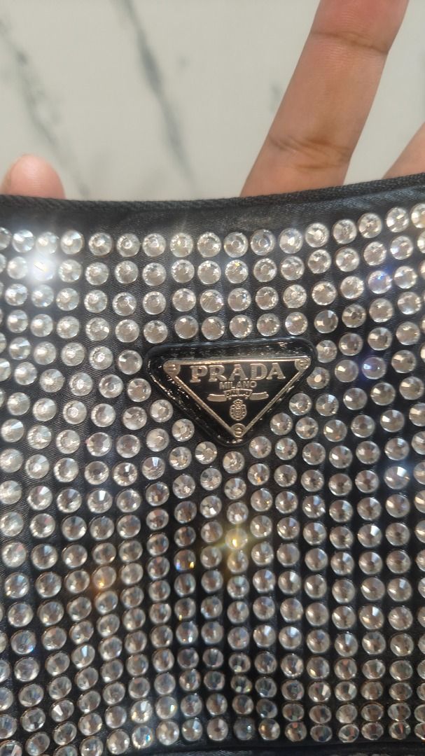 Prada Rhinestone Shoulder Bag (Category: Luxury Bags & Wallets) located in Caloocan City. Submitted by aliling30 (Listing ID 1454588222, Image 2). Description: - Sparkly Prada shoulder bag - Covered in rhinestones - Black leather trim - Zipper closure - Adjustable strap - Ideal for nights out or adding glam to your outfit - Please check photos for details.