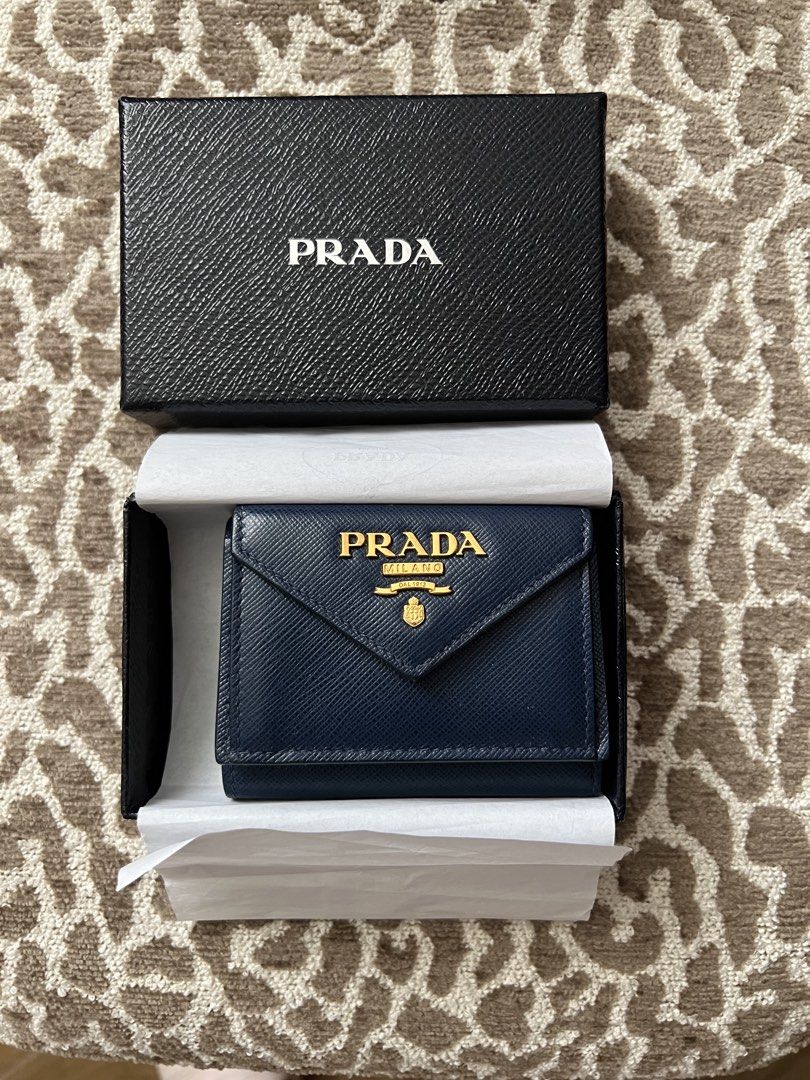 Prada Saffiano Metal Bluette Tri-fold Wallet (Category: Luxury Bags & Wallets) located in Santa Rosa. Submitted by charmainev31426 (Listing ID 1449762992, Image 2). Description: - Authentic Prada Saffiano Metal Wallet - Color: Bluette - Includes original box, authenticity card - Purchase Date: July 26, 2019 - Ideal for everyday use.