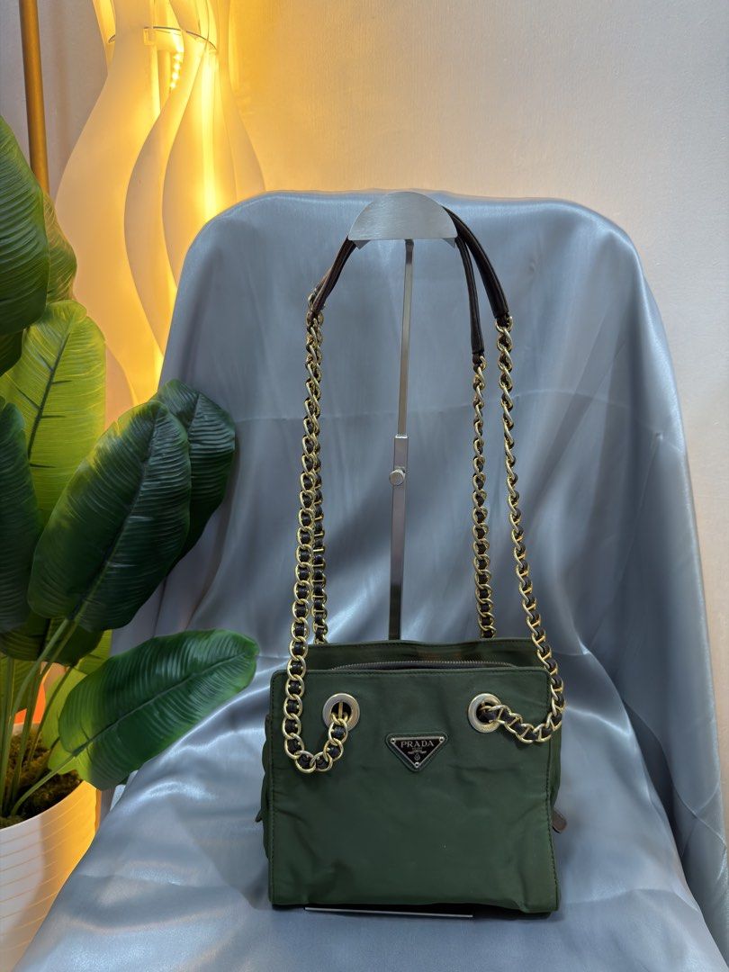 PRADA TESSUTO NYLON CHAIN SHOULDER BAG (Category: Luxury Bags & Wallets) located in Paranaque City. Submitted by houseofcarry (Listing ID 1454731684, Image 2). Description: • Guaranteed Authentic 💯 — Money-back guarantee if proven otherwise • Condition: Rank AB • Please note that there is some discoloration on the interior and sides due to age. As this is a vintage/pre-loved piece, minor signs of wear are to be expected and are part of its chara
