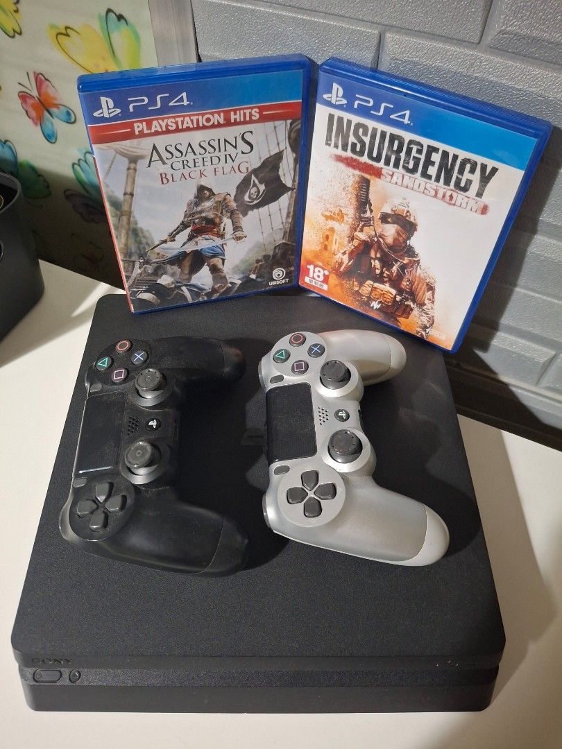 PS4 slim with 2 free games with controller (Category: PlayStation) located in Taguig. Submitted by nervccc (Listing ID 1454670417, Image 2). Description: - Ps4 slim 500gb with Insurgency Sandstorm & Assassin's Creed IV: Black Flag - games are in perfect condition - console has no issue - Comes with original cases - with 2 free original ps4 controllers (missing joystick cover) - price negotiable .