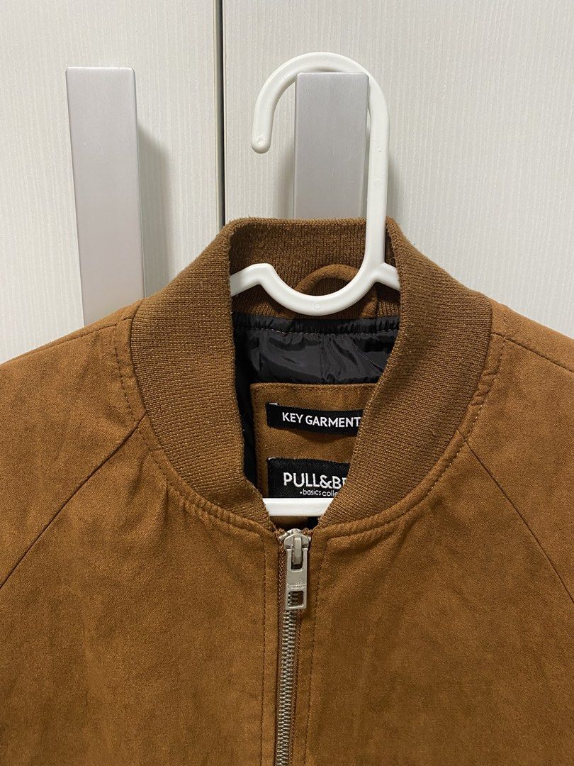 Pull & Bear Suede Bomber Jacket (Category: Coats, Jackets and Outerwear) located in Paranaque City. Submitted by thriftingclouds (Listing ID 1454675991, Image 3). Description: Brand: Pull & Bear Color: Brown Material: Suede Size: Small Measurement: 18 x 26 in No issue.
