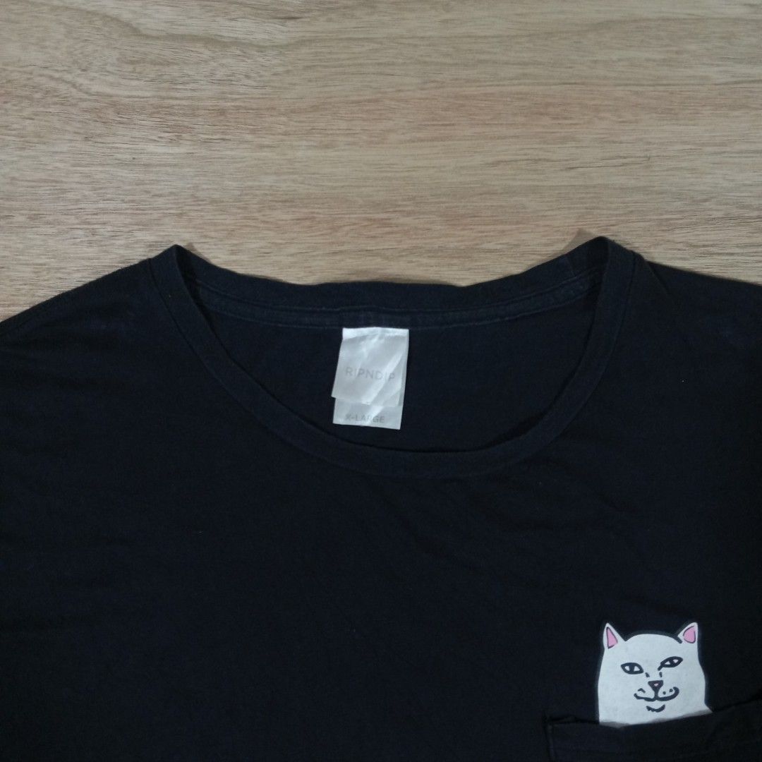 RIPNDIP Lord Nermal Pocket Tshirt (Category: Activewear) located in Manila. Submitted by sito. (Listing ID 1454711254, Image 3). Description: RIPNDIP Lord Nermal Pocket Tshirt Size: X-Large Length: 27 Width: 20 Color rate: 9.5/10 Issue: None Good Condition 🏷️ : ₱ 249 📦 : PLUS SHIPPING FEE 📍 : Upper Bicutan, Taguig City This piece is PRIZE, We can deal, Mate! Hit the message so we can Negotiate. Thanks, have a blessed day to all! 🙇🏽.