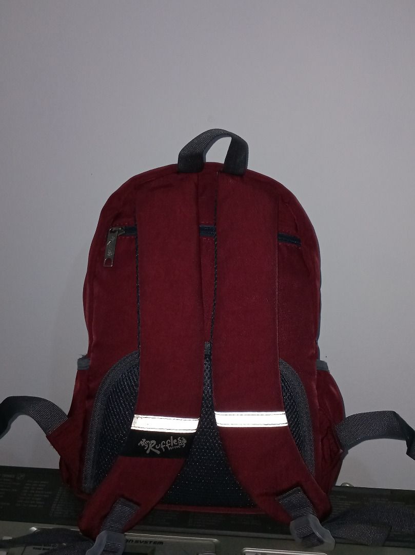 Ruffles Maroon Backpack (Category: Backpacks) located in Caloocan City. Submitted by safedeer_cd4f15 (Listing ID 1454708244, Image 3). Description: - Stylish maroon backpack with strap na umiilaw kapag may flash/light. - 2 front zippered pockets, 1 zippered pocket at the back for anti-theft. - Features a convenient front zippered pocket for quick access. - Made from durable fabric, built to last. - Offers ample space inside for all your essential