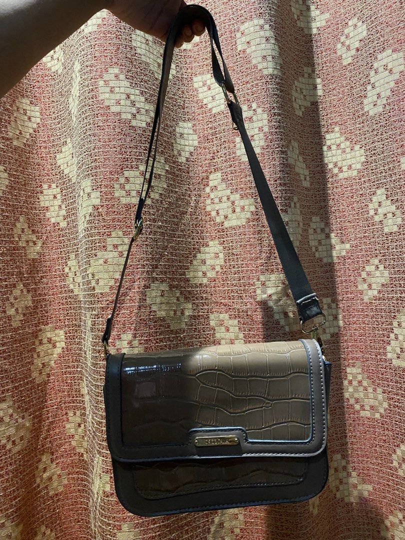 Saccosana Croc Embossed Crossbody Bag (Category: Cross-body Bags) located in Manila. Submitted by itzyshin (Listing ID 1454623574, Image 1). Description: Adjustable strap. No flaws With dust bag .