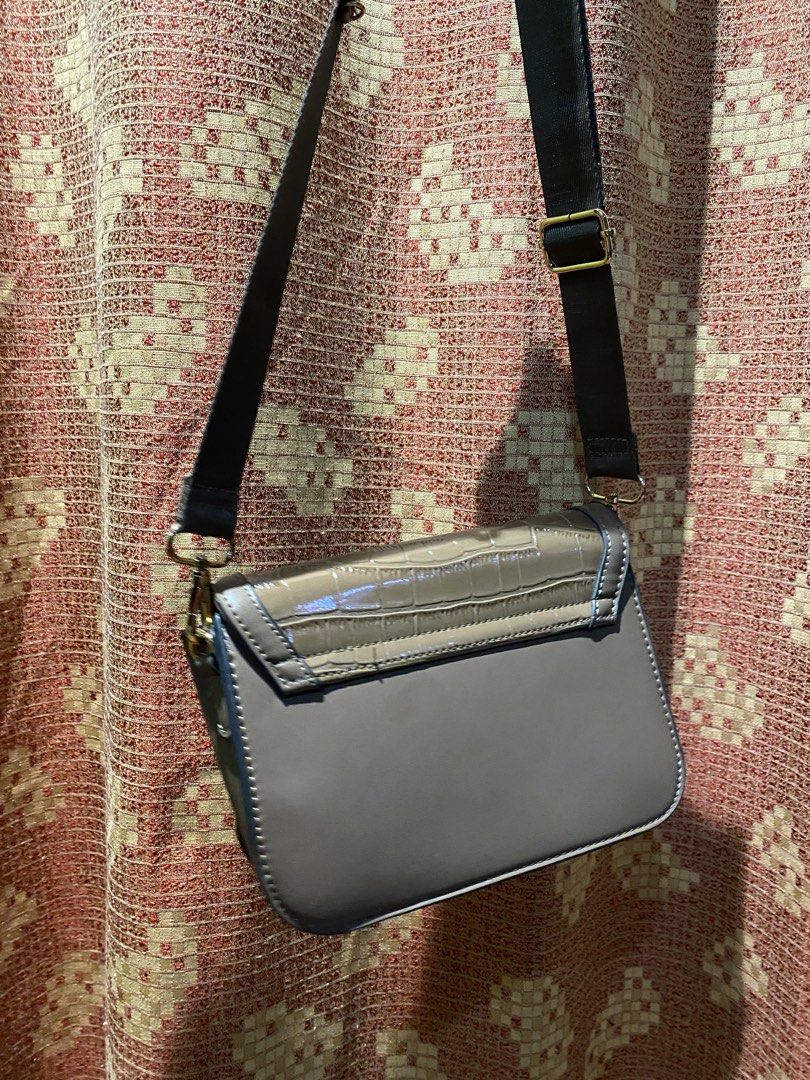 Saccosana Croc Embossed Crossbody Bag (Category: Cross-body Bags) located in Manila. Submitted by itzyshin (Listing ID 1454623574, Image 3). Description: Adjustable strap. No flaws With dust bag .