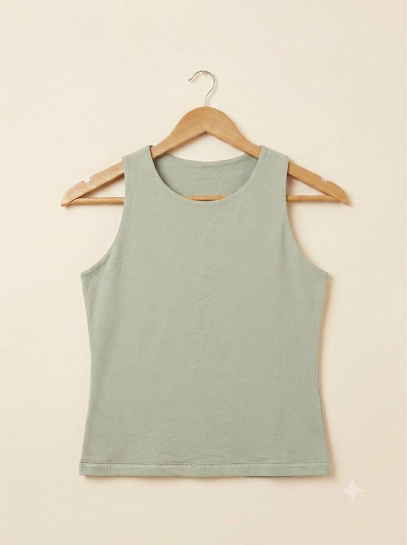 Sage Green Sleeveless Tank Top (Category: Sleeveless) located in Bacoor. Submitted by xazshx (Listing ID 1454591623, Image 1). Description: Double lining - Simple sage green tank top - Sleeveless with rounded neckline - Soft and comfortable fabric - Versatile for layering or casual outfits - Clean, double-stitched hem.
