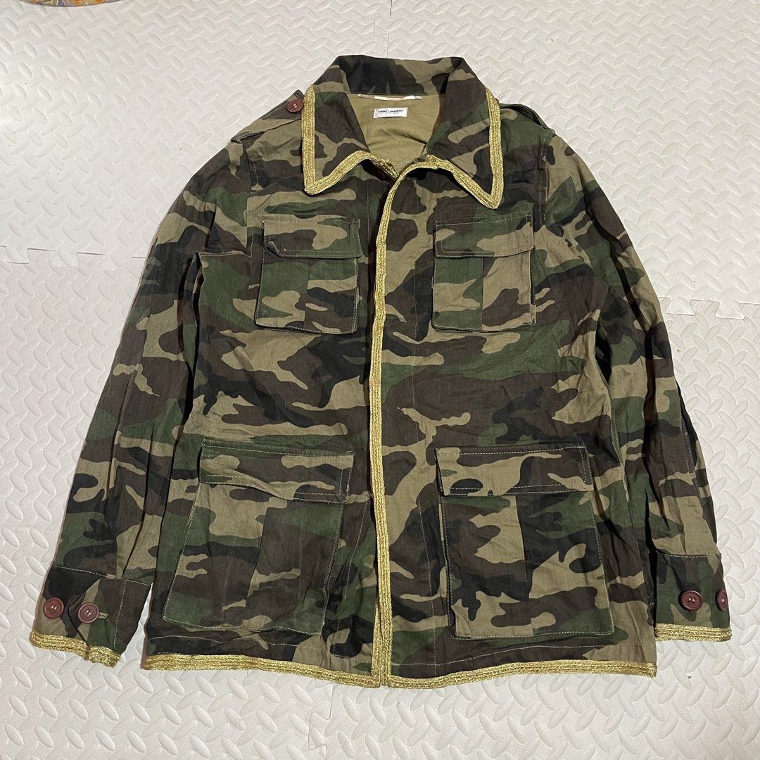 Saint Laurent Paris Camo Jacket with Gold Trim (Category: Coats, Jackets and Outerwear) located in Zamboanga. Submitted by selvege (Listing ID 1454749444, Image 1). Description: - Authentic Saint Laurent Paris jacket - Classic camouflage print - Gold trim accent on collar and placket - Button closure with branded buttons - Made in Italy - Size 42 Dimes 21.5 x 28.