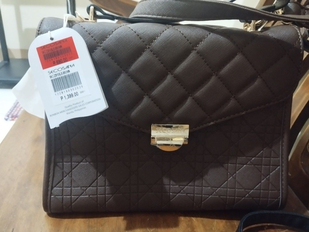 Secosana Quilted Brown Handbag (Category: Shoulder Bags) located in Manila. Submitted by ljaneee (Listing ID 1454634165, Image 3). Description: - Brand: Secosana - Color: Brown - Material: Quilted - Closure: Gold clasp - Interior: Zippered compartment - Condition: Brand new with original tag - Original Price: P1,399.00 - Manufacturer: Ronbon Mfrs. & Hangers Sales Corp. (Manila, Philippines).