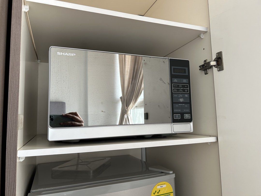 Sharp Microwave (Category: Ovens & Toasters) located in Singapore. Submitted by skgsg (Listing ID 1454641539, Image 1). Description: Sharp Microwave 20L Rarely used and it is in working condition See images attached and for the condition Condition is 10/10 Model number : 20L Basic Microwave Oven R-22A0(SM)V .