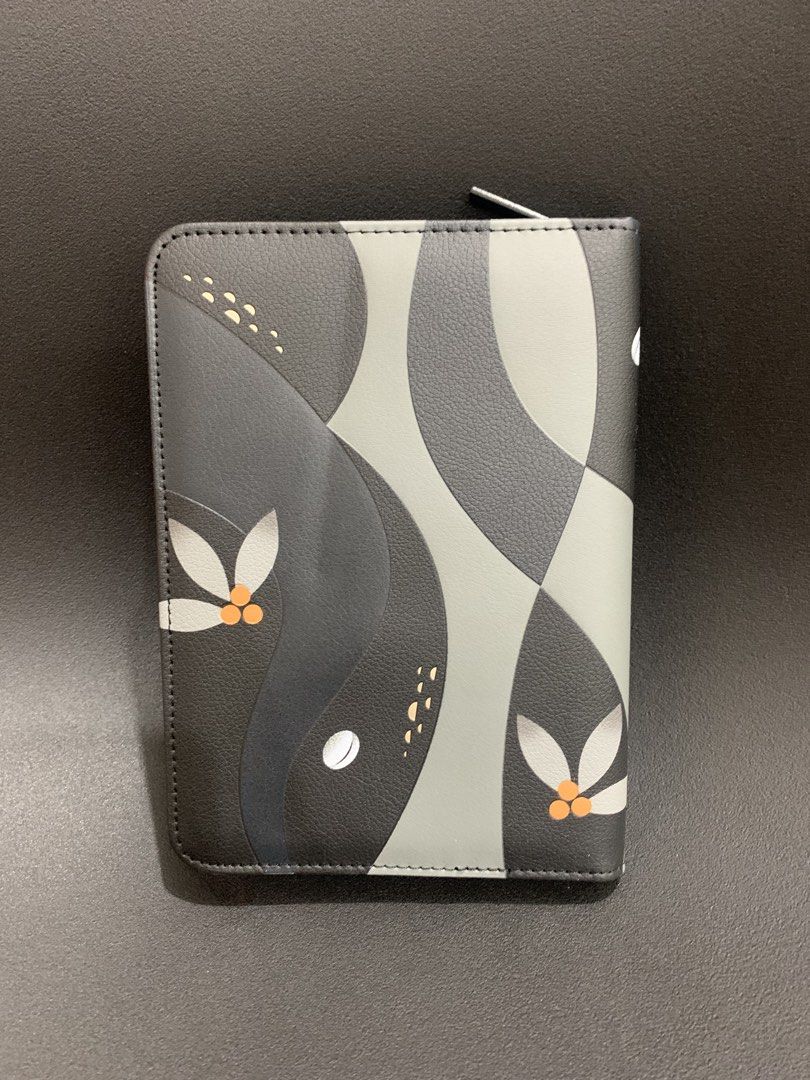 Starbucks Organizer Pouch with Stickers (Category: Looking For) located in Manila. Submitted by ele.ele (Listing ID 1454695264, Image 2). Description: - Stylish Starbucks organizer pouch with a unique abstract design. - Features multiple card slots for your cards. - Includes a larger compartment for other essentials. - Comes with two Starbucks logo stickers (black/white and green). - Secure zipper closure to keep everything safe. - Perfect for or