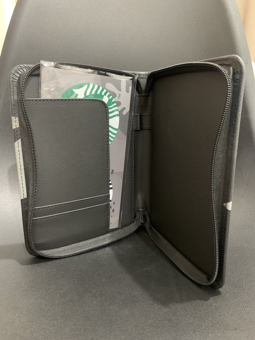 Starbucks Organizer Pouch with Stickers (Category: Looking For) located in Manila. Submitted by ele.ele (Listing ID 1454695264, Image 3). Description: - Stylish Starbucks organizer pouch with a unique abstract design. - Features multiple card slots for your cards. - Includes a larger compartment for other essentials. - Comes with two Starbucks logo stickers (black/white and green). - Secure zipper closure to keep everything safe. - Perfect for or