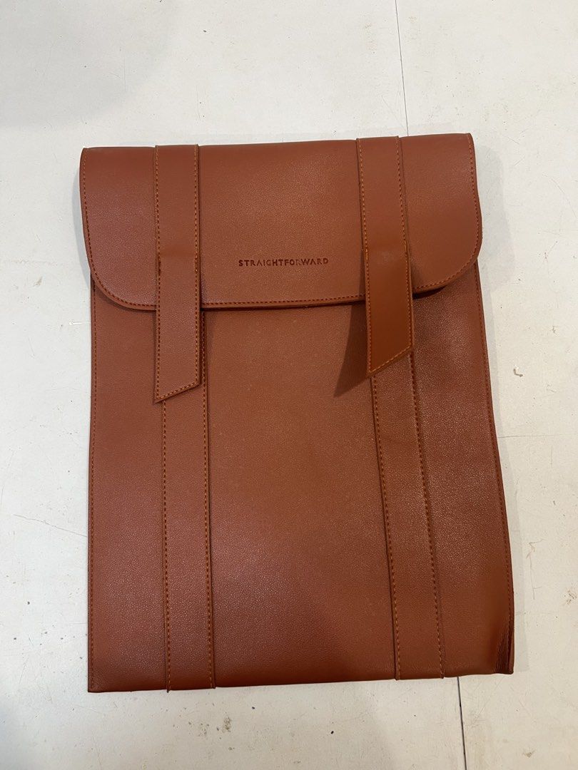 Straightforward Brown Leather Laptop Sleeve (Category: Laptop Bags & Sleeves) located in Quezon City. Submitted by mitchabrio (Listing ID 1454602595, Image 1). Description: - Genuine brown leather sleeve from Straightforward - Minimalist design with secure strap closures - Perfectly fits your laptop - Provides excellent protection for your device - Clean and simple aesthetic.