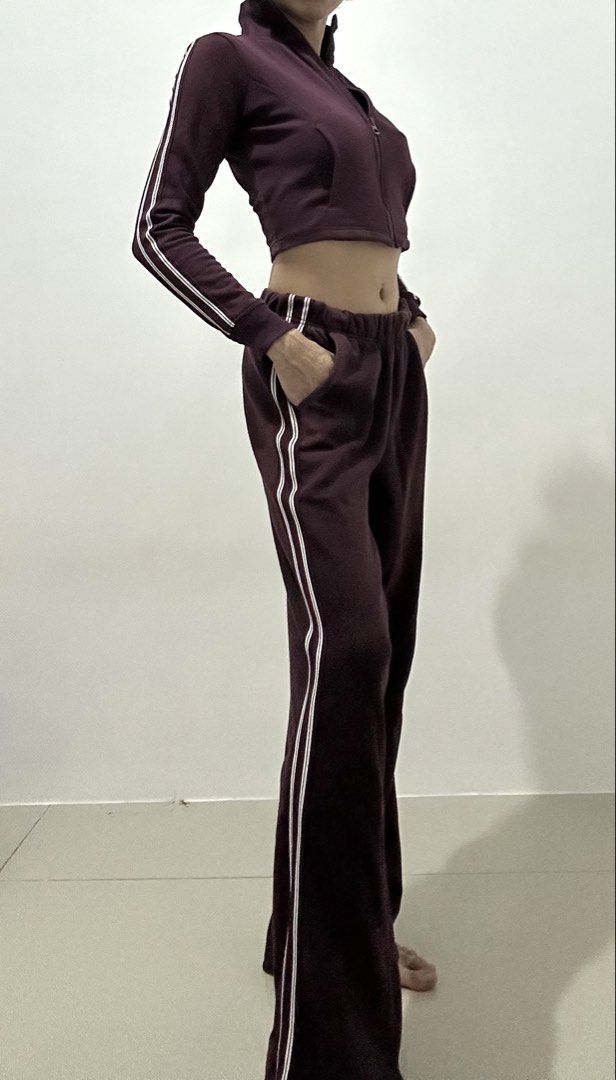 TERRANOVA : Maroon Tracksuit Set - Cropped Jacket & Flare Pants (Category: Sets or Coordinates) located in Makati City. Submitted by avalanche18 (Listing ID 1454694511, Image 3). Description: - Maroon tracksuit set - Includes cropped zip-up jacket and matching flare pants - Features white stripe details on sleeves and pant sides - Comfortable and stylish for casual wear - Pants have an elastic waistband and pockets.