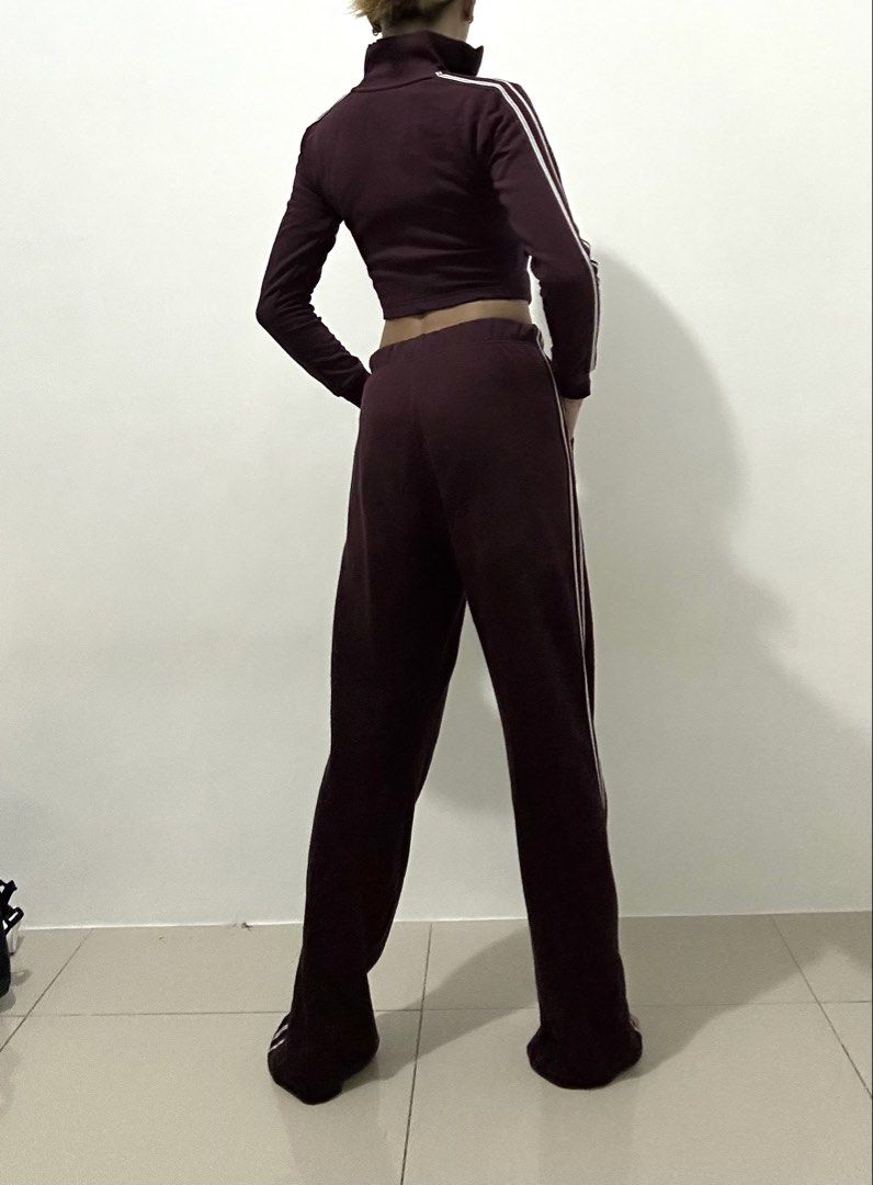 TERRANOVA : Maroon Tracksuit Set - Cropped Jacket & Flare Pants (Category: Sets or Coordinates) located in Makati City. Submitted by avalanche18 (Listing ID 1454694511, Image 2). Description: - Maroon tracksuit set - Includes cropped zip-up jacket and matching flare pants - Features white stripe details on sleeves and pant sides - Comfortable and stylish for casual wear - Pants have an elastic waistband and pockets.