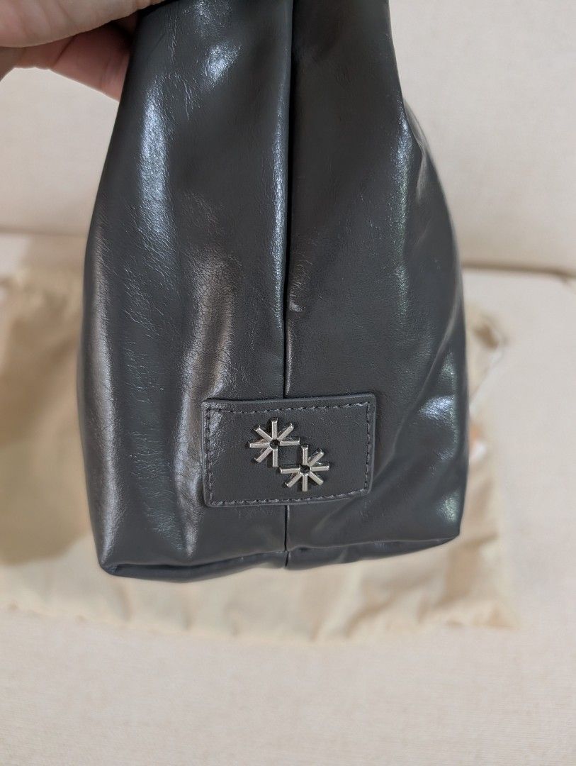 The Paper Bunny Mini Arc Gunmetal (Category: Shoulder Bags) located in Manila. Submitted by cart_rd (Listing ID 1454652725, Image 2). Description: - Dark grey shoulder bag - Shiny, patent-like material - Main zip compartment - Exterior pocket - Small embossed logo on the side - Comes with a dust bag - Ideal for everyday use - used once only, very good condition .