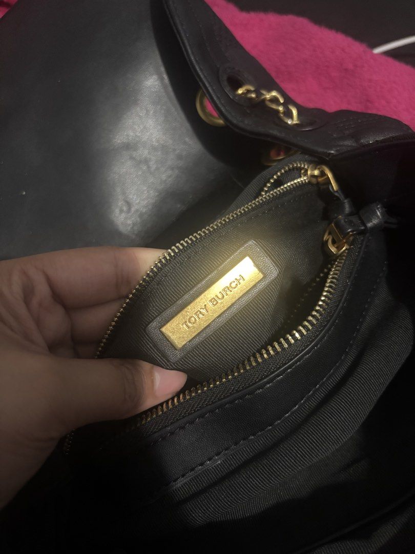 Tory Burch Black Leather Quilted Chain Shoulder Bag (Category: Luxury Bags & Wallets) located in Mandaluyong City. Submitted by kylienicole.214 (Listing ID 1454565236, Image 2). Description: - Genuine black leather Tory Burch bag - Elegant quilted design - Stylish gold chain strap - Interior features signature gold Tory Burch logo plate - Versatile: ideal for everyday use or evening events - Spacious interior for your essentials.