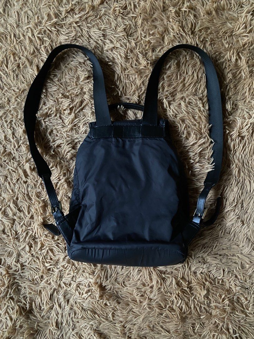 Tory Burch Virginia Backpack Nylon/Leather (Category: Luxury Bags & Wallets) located in Cebu City. Submitted by patspickph (Listing ID 1454664884, Image 3). Description: This is a Tory Burch Virginia Backpack featuring a black nylon body, a drawstring closure, and a flap top with an embossed logo. Original/ Authentic bag. Minimal sign of usage still in excellent condition👍.