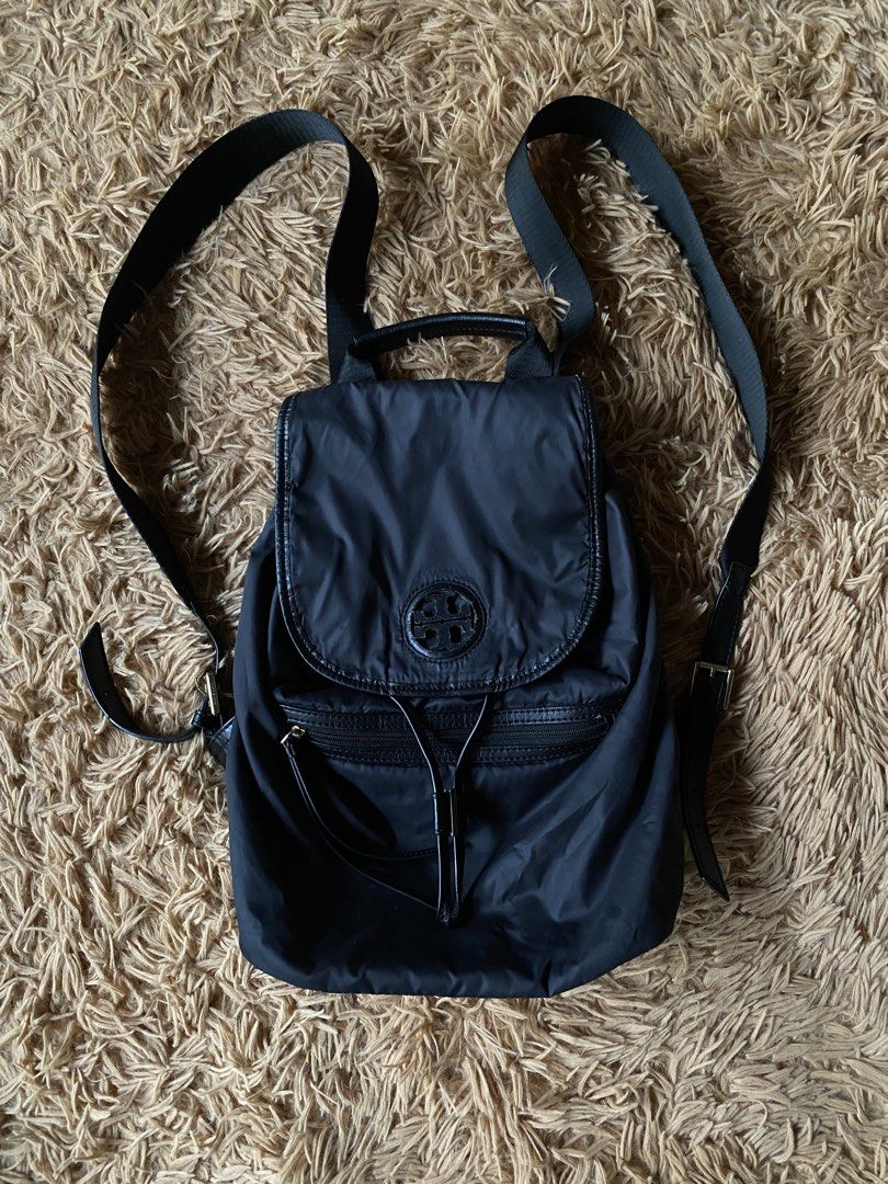 Tory Burch Virginia Backpack Nylon/Leather (Category: Luxury Bags & Wallets) located in Cebu City. Submitted by patspickph (Listing ID 1454664884, Image 1). Description: This is a Tory Burch Virginia Backpack featuring a black nylon body, a drawstring closure, and a flap top with an embossed logo. Original/ Authentic bag. Minimal sign of usage still in excellent condition👍.