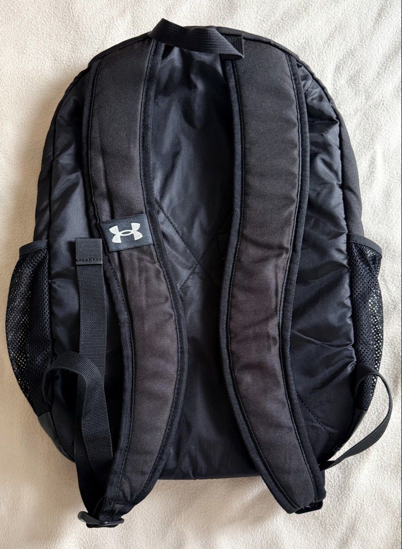 Under Armour UA Roland Backpack (Category: Backpacks) located in Valenzuela. Submitted by jatentenenen (Listing ID 1454647533, Image 2). Description: * 2 large main compartments with zippered closures * Soft-lined, padded laptop sleeve—holds up to 15” MacBook Pro® or similarly sized laptop * Adjustable shoulder straps for extra comfort * Side water bottle pocket * Top grab handle * 17L * Check website for the full product details : https://www.un