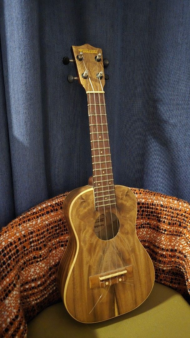 Used Fernando Ukulele (Category: Musical Instruments) located in Manila. Submitted by oceancadwaller (Listing ID 1454726565, Image 2). Description: Pre-loved Fernando ukulele with a beautiful natural wood finish. Filipino-made and has a classic vintage look. Brand: Fernando Type: Ukulele Condition: Used Material: Wood Strings: 4 Has visible signs of age and use, including scratches/surface marks. Please check all photos for the actual condition. 