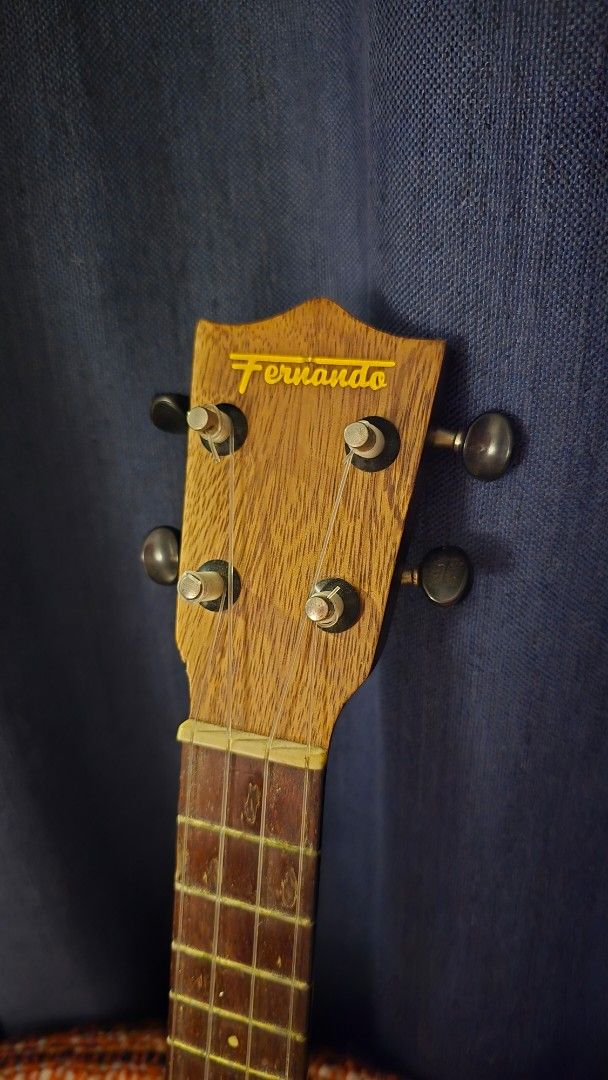 Used Fernando Ukulele (Category: Musical Instruments) located in Manila. Submitted by oceancadwaller (Listing ID 1454726565, Image 1). Description: Pre-loved Fernando ukulele with a beautiful natural wood finish. Filipino-made and has a classic vintage look. Brand: Fernando Type: Ukulele Condition: Used Material: Wood Strings: 4 Has visible signs of age and use, including scratches/surface marks. Please check all photos for the actual condition. 