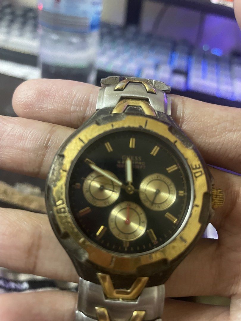 Vintage Guess Waterpro Watch (Category: Men's Watches) located in Manila. Submitted by 2002kid (Listing ID 1454687266, Image 3). Description: vintage GUESS Waterpro chronograph Color: Two tone Silver and Gold watch featuring a two-tone silver and gold stainless steel design with a black dial. The watch is rated for 50 meters (165 feet) of water resistance.It includes a rotating bezel and analog quartz movement. Issue: Need Polish And Fix Not Work