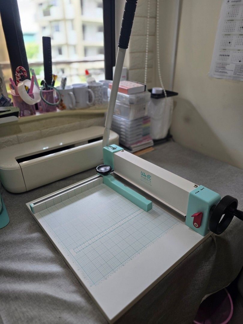 We R Makers Cinch Stack Cutter Paper Crafting Tool (Category: Craft Supplies & Tools) located in Paranaque City. Submitted by rekeep (Listing ID 1454716285, Image 1). Description: - Cinch Stack Cutter - perfect for paper crafts & scrapbooking. - Built-in grid lines for accurate cuts. - Easy-to-use lever action. - Handle folds down for convenient storage. - Stylish mint green and white design..