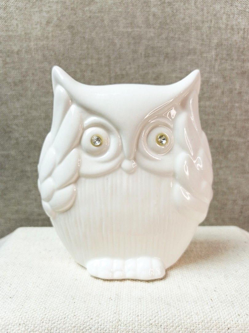 White Ceramic Owl Figurine with Rhinestone Eyes (Category: Other Home Decor) located in Baguio. Submitted by rustyribbon (Listing ID 1454691179, Image 1). Description: ceramic owl with rhinestone eyes 4.8" h x 4.5" x 2" 220 + sf mop: gcash/maya 0962 546 5810 (S***L***H) mod: j&t .