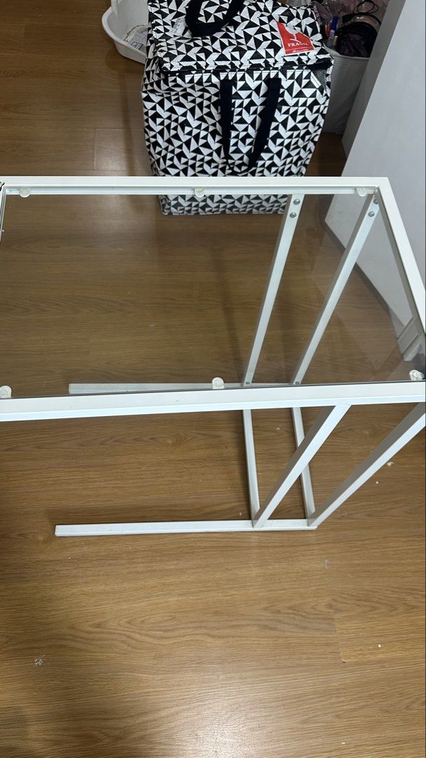 White Metal and Glass Side Table (Category: Tables & Sets) located in Manila. Submitted by acfabales (Listing ID 1454613039, Image 1). Description: - Sleek white metal frame - Clear glass tabletop - Modern, minimalist design - Ideal for living room or bedroom - Easy to maintain and clean - Durable and sturdy construction.