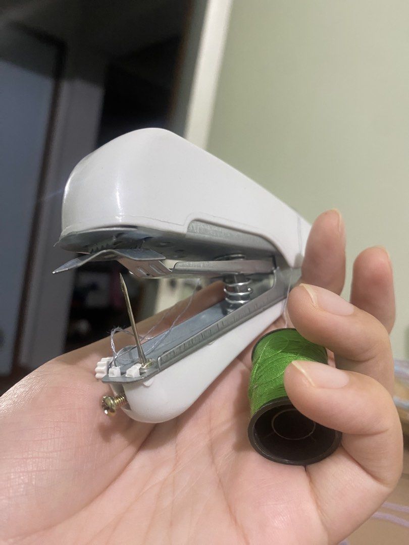 White Portable Handheld Sewing Machine with Green Thread Spool (Category: Craft Supplies & Tools) located in Manila. Submitted by nicolezald25729 (Listing ID 1454741233, Image 3). Description: - Compact handheld sewing machine - Ideal for quick repairs and small projects - Comes with a green thread spool - Easy to use for mending clothes or fabric crafts - Lightweight and portable design - Perfect for home storage or travel Rfs: My sister doesn’t