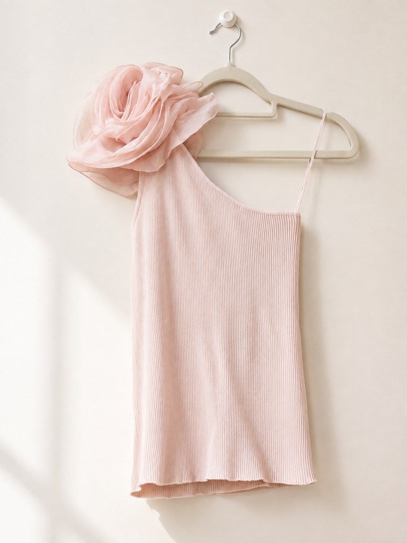 Zara Blush Organza Rose Ribbed Top (Category: Dresses) located in Manila. Submitted by theopal (Listing ID 1454655727, Image 3). Description: * Blush pink one-shoulder top * Fine ribbed texture * Asymmetrical neckline with one bare shoulder * Oversized sheer layered flower detail on the shoulder * Fitted, body-hugging silhouette * Stretchy fabric that comfortably hugs the body * Cropped length * Feminine and elegant statement piece * Perfect for 