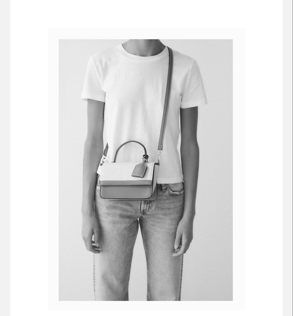 Zara Canvas Mini City Bag (Category: Luxury Bags & Wallets) located in Manila. Submitted by harleyy1230 (Listing ID 1454724756, Image 3). Description: - Zara mini city bag -Has stains - Includes a detachable, adjustable crossbody strap - Dimensions: Height 14 cm, Width 18.5 cm, Depth 8.5 cm.