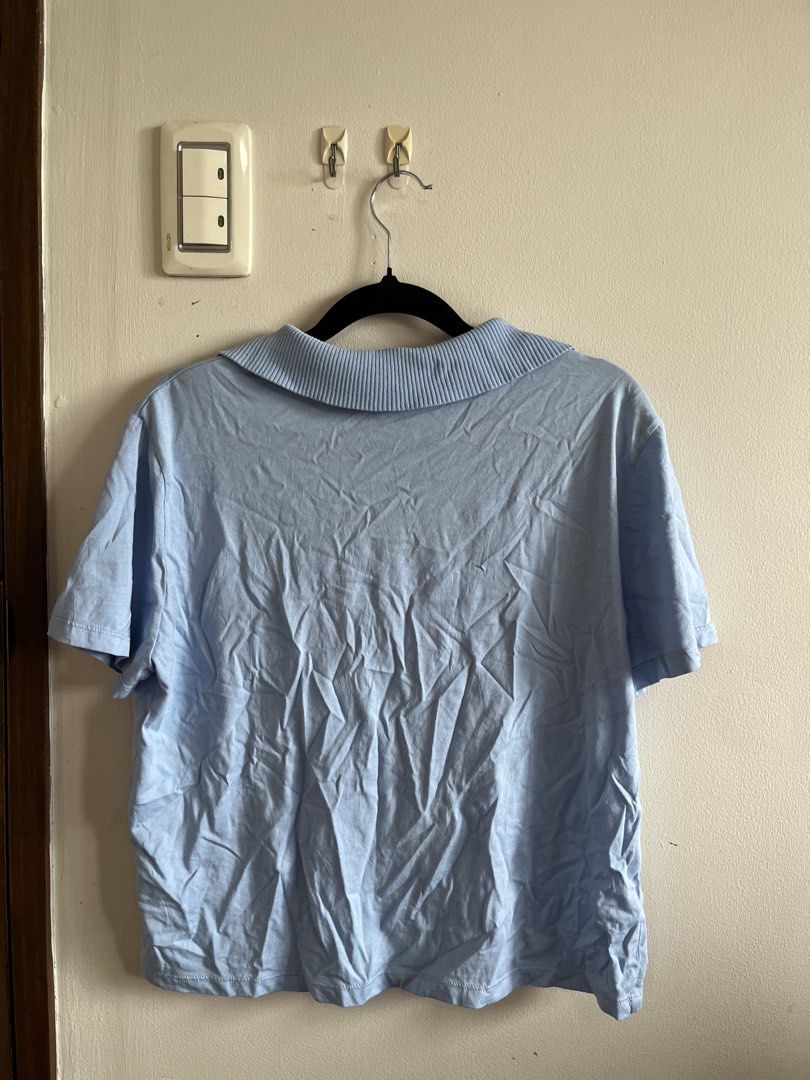 Zara Light Blue Collared Short Sleeve Top (Category: Blouses) located in Muntinlupa City. Submitted by lovedbysabel (Listing ID 1454623249, Image 3). Description: Light blue collared top from Zara. Short sleeves with a ribbed collar detail. Easy to style for casual or smart-casual looks. Size M. No flaws at all and in very good condition.