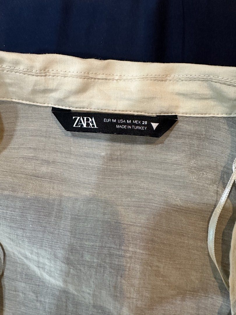 Zara Sheer Crop Top (Category: Longsleeves) located in Paranaque City. Submitted by applemt (Listing ID 1454657968, Image 3). Description: LAST PRICE, NO MORE HAGGLING. - Rare piece and super nice in person - 22” armpit to armpit when laid flat - oversized long sleeves with drop shoulders for that relaxed fit - Material: Lyocell, feels like a softer in organza - Features: Button-down front, classic collar, cropped length - Condition: Like new, wo