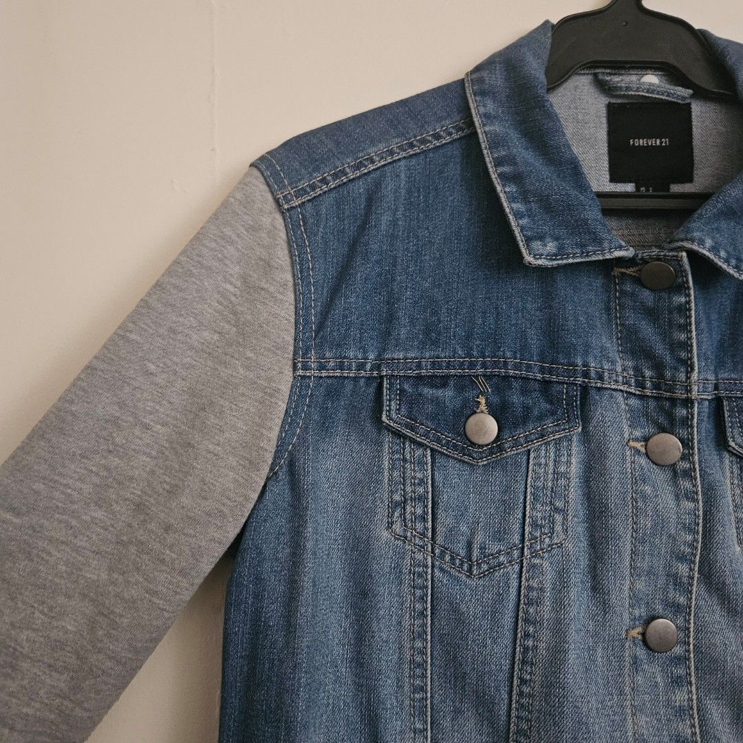 10. Forever 21 Denim Jacket with Grey Sleeves Size S (Category: Coats, Jackets and Outerwear) located in San Juan City. Submitted by titaofmanilaessentials (Listing ID 1458908642, Image 2). Description: - Forever 21 denim jacket - Grey contrast sleeves - Button-up front - Chest pockets - Size S - Ideal for layering - Used less than 10x - RFS: Too small.
