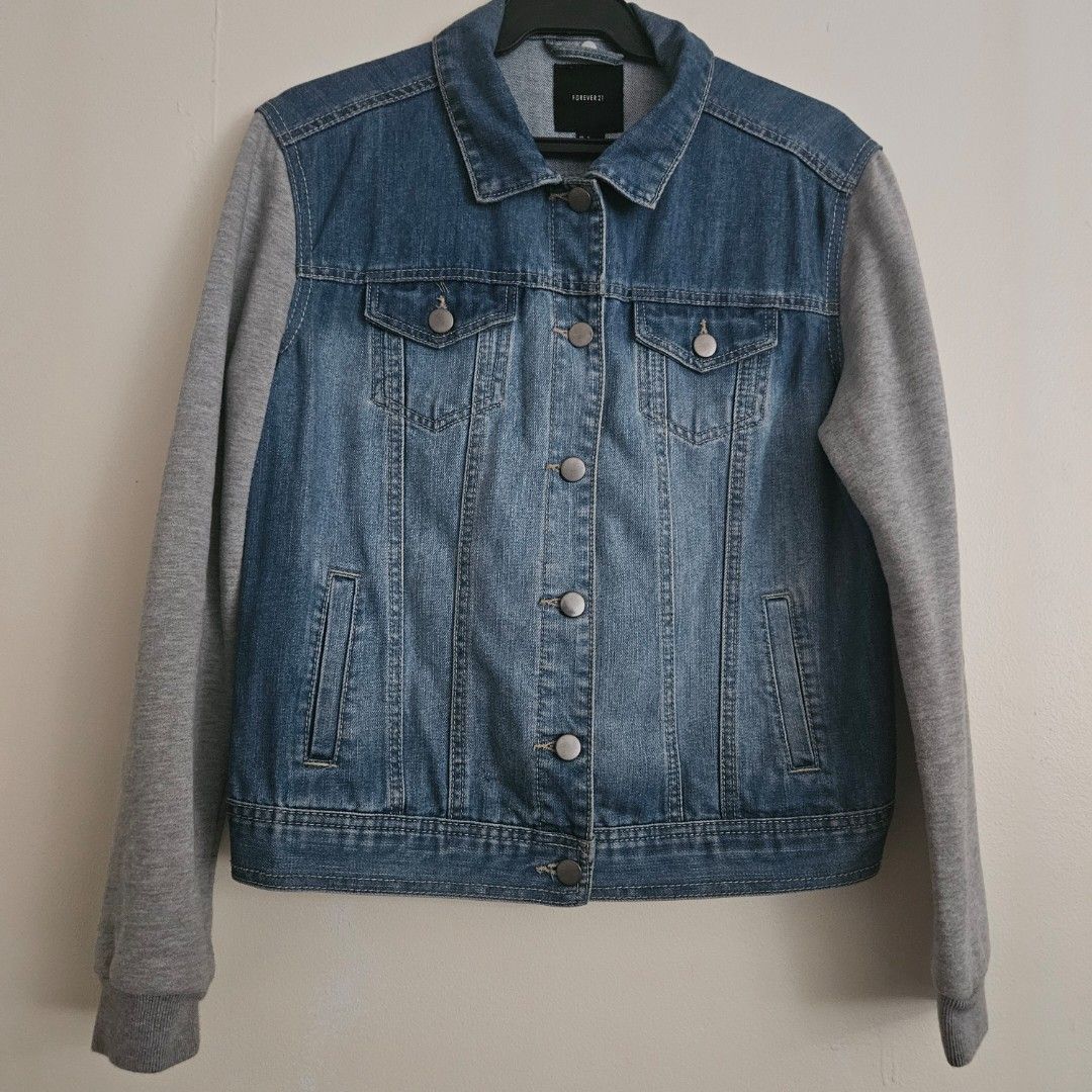 10. Forever 21 Denim Jacket with Grey Sleeves Size S (Category: Coats, Jackets and Outerwear) located in San Juan City. Submitted by titaofmanilaessentials (Listing ID 1458908642, Image 1). Description: - Forever 21 denim jacket - Grey contrast sleeves - Button-up front - Chest pockets - Size S - Ideal for layering - Used less than 10x - RFS: Too small.