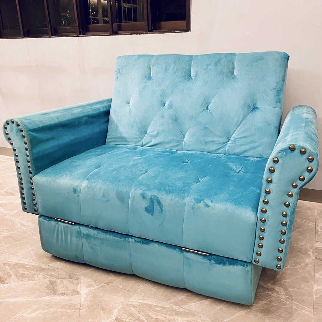 2-Seater Sofa Bed (Category: Sofas) located in Taguig. Submitted by boxheads (Listing ID 1459064680, Image 3). Description: 2-Seater Sofa Bed • Light blue velvet feel fabric • Tufted backrest and seat • Nailhead/stud detailing on armrests • Cute & cozy • Well used Negotiable but no lowballing please 🙏🏻 Issues/Condition: • Needs cleaning • Missing nailhead/stud • No legs Location: 📍Ususan, Taguig City Delivery: 🚐 Lalamove (buyer shoulders deli