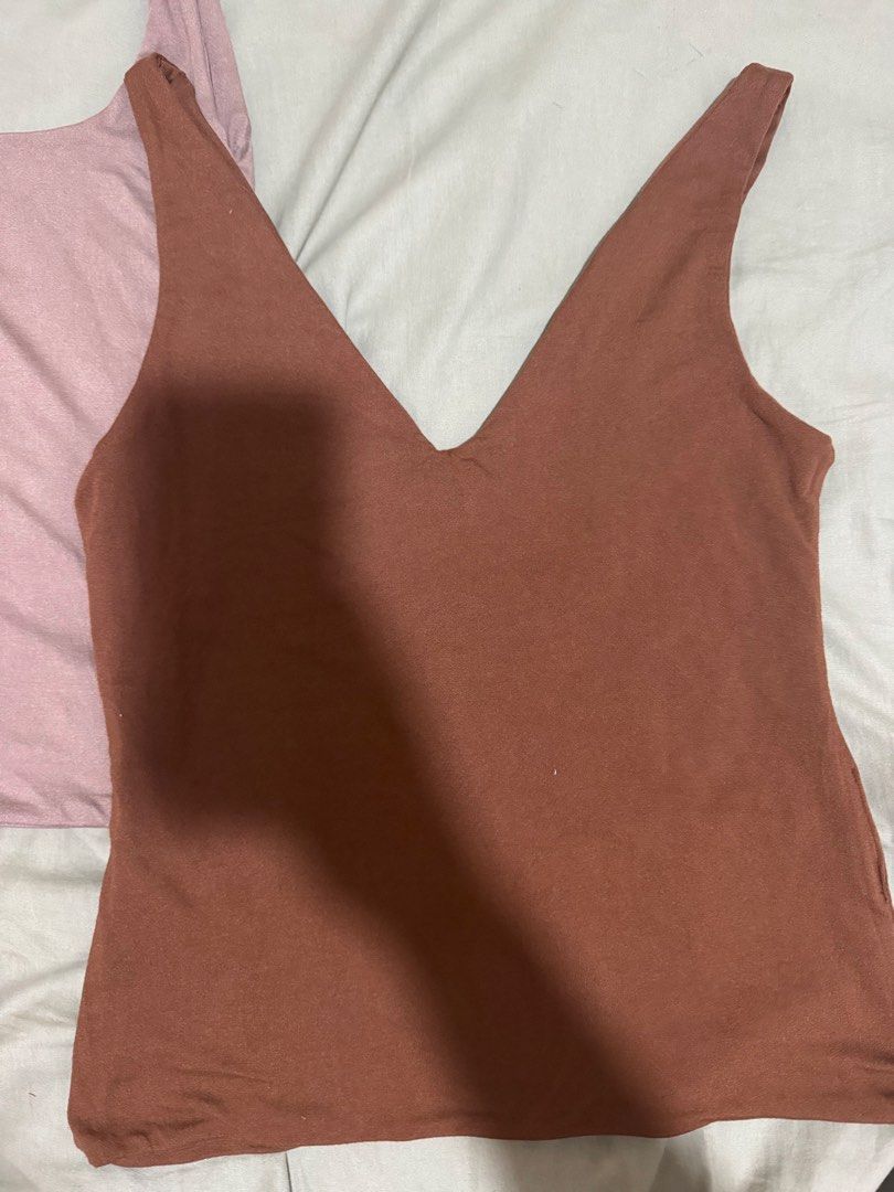 2x Basic Tank Tops - Brown & Beige (Category: Sleeveless) located in Mandaluyong City. Submitted by chubs08 (Listing ID 1459028779, Image 2). Description: - 250/each.400/2pcs -Deep brown V-neck tank top - Dusty beige square-neck tank top - Made of soft, stretchy material - Ideal for layering or wearing on its own - Comfortable and versatile basics.