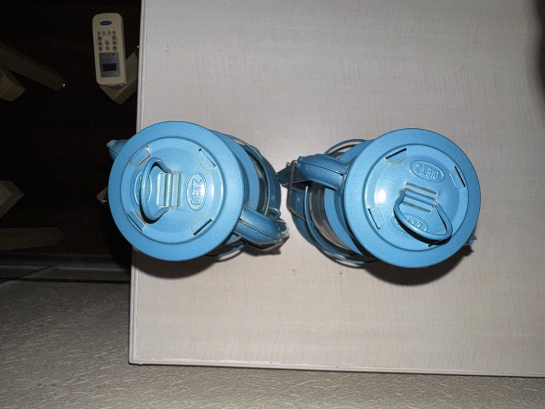 2x DIETZ Lanterns - Battery Operated (Category: Lighting) located in Makati City. Submitted by avic_c (Listing ID 1458899335, Image 3). Description: Matching pair of DIETZ lanterns in a striking vintage blue/teal finish. DIETZ branding is embossed on the lanterns, with “23” marking. Both come with glass globes. Cover for batteries missing. Good display condition with age-related wear, patina and some oxidation around the burner areas. Glass appea