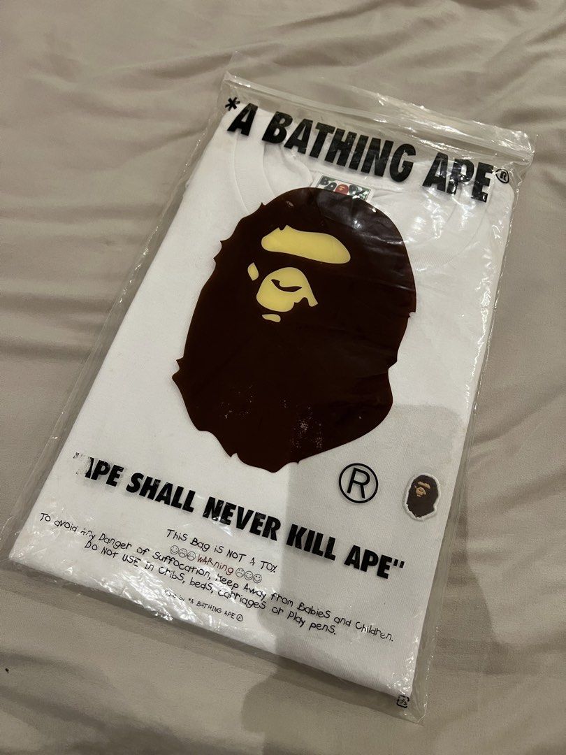 BAPE One Point Tee Size L (Category: Tshirts & Polo Shirts ) located in Quezon City. Submitted by shopsecondfits (Listing ID 1459034623, Image 2). Description: Has yellow stains due to storage SRP: P8700 - White BAPE T-shirt - Features iconic ape head graphic - Comes in original packaging - Size: Large (L) - Ideal for streetwear enthusiasts - A classic piece to add to your collection.