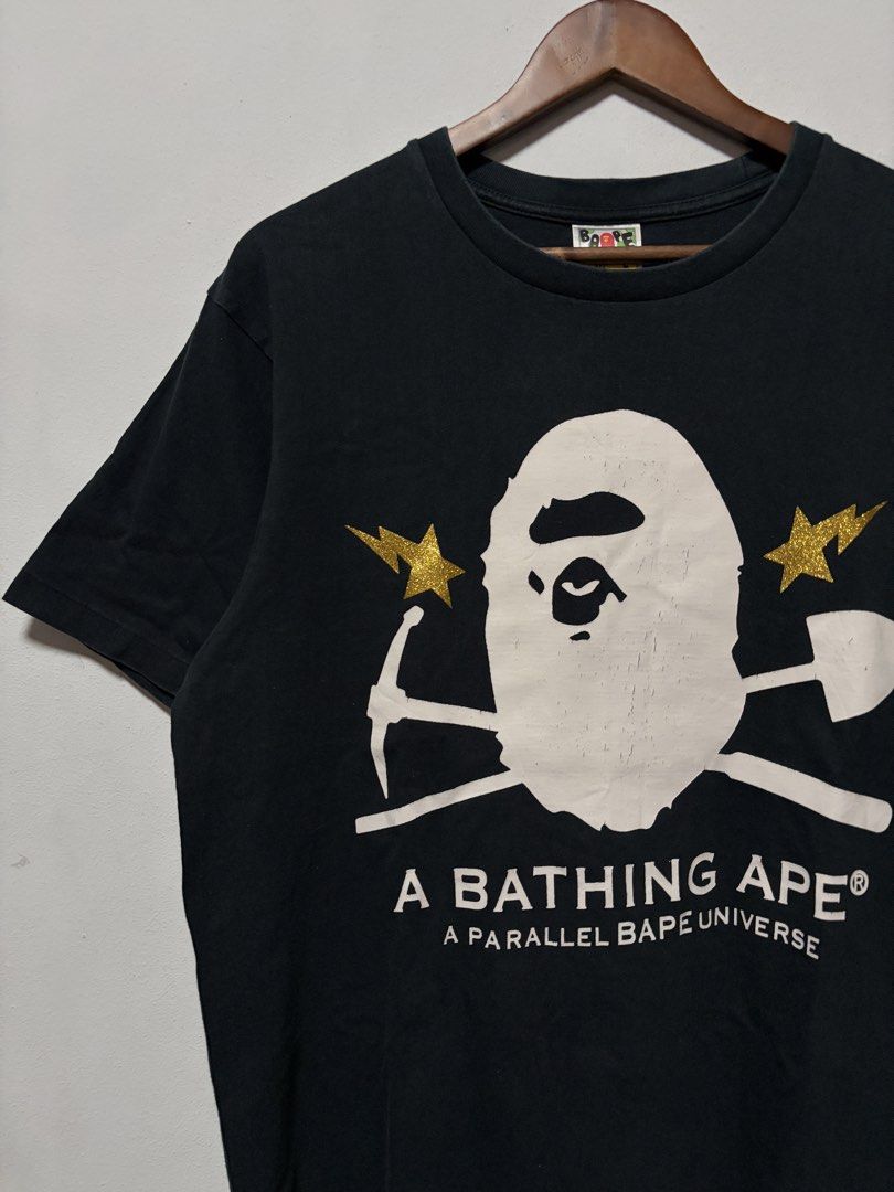 A Bathing Ape Gold Rush Foil Tee (Category: Tshirts & Polo Shirts ) located in Calamba. Submitted by jim.ibe066 (Listing ID 1458987868, Image 3). Description: A Bathing Ape Gold Rush Foil Tee Size Large width 22 length 27 Very good condition 9.5/10 conditions and color rate -Can pass as very good condition no any pinholes, no any stains or faded part Issue: Some minimal crack prints see on pic Calamba City, Laguna 📍 .