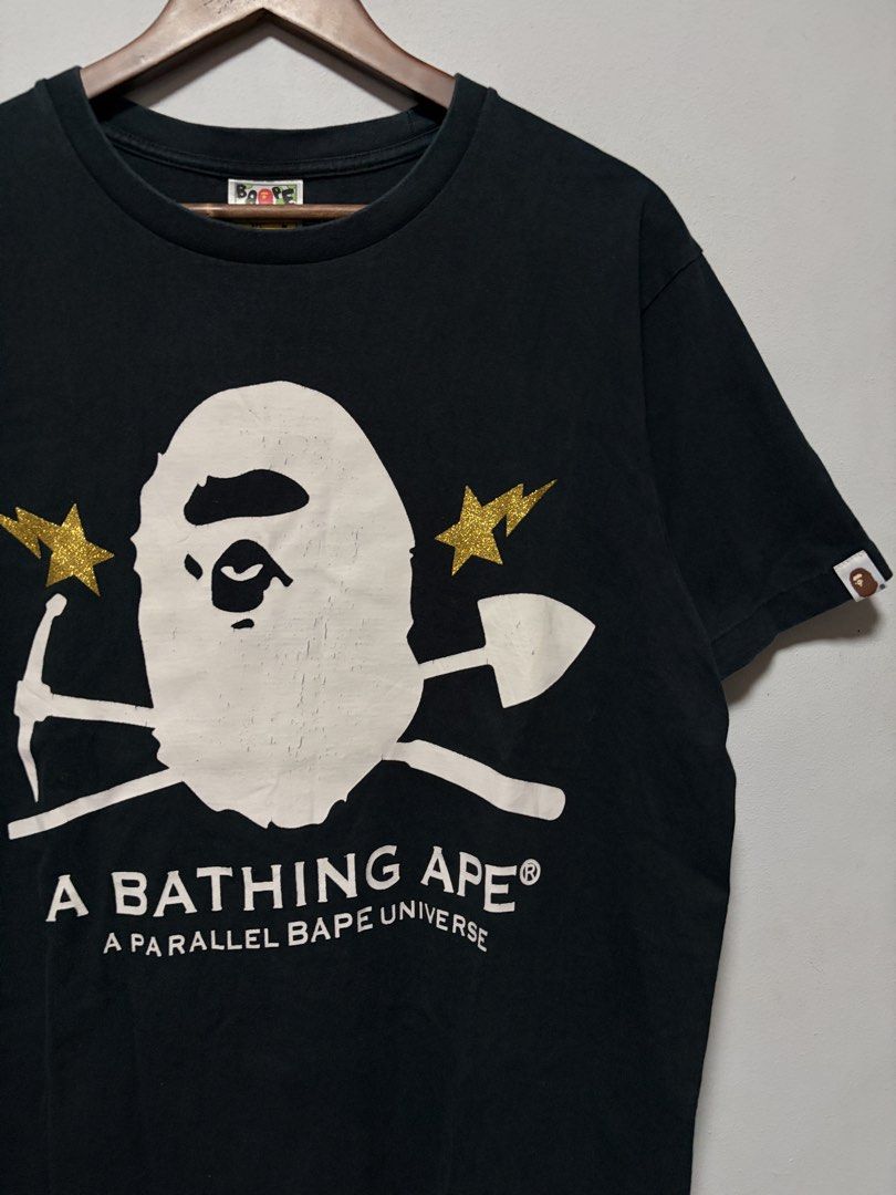 A Bathing Ape Gold Rush Foil Tee (Category: Tshirts & Polo Shirts ) located in Calamba. Submitted by jim.ibe066 (Listing ID 1458987868, Image 2). Description: A Bathing Ape Gold Rush Foil Tee Size Large width 22 length 27 Very good condition 9.5/10 conditions and color rate -Can pass as very good condition no any pinholes, no any stains or faded part Issue: Some minimal crack prints see on pic Calamba City, Laguna 📍 .
